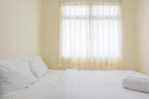 Homey 2BR at Serpong Greenview Apartment By Travelio