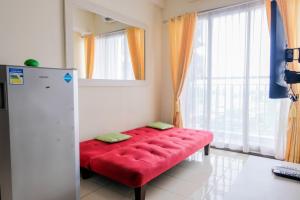 Homey 2BR at Serpong Greenview Apartment By Travelio