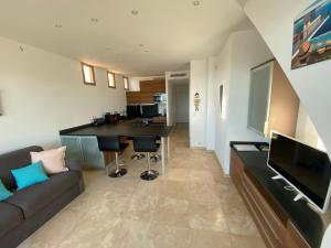 Appartements T2 en duplex avec solarium face mer : photos des chambres