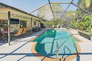 Three-Bedroom House room in New Listing! Sparkling Home with Caged Pool & Lanai home