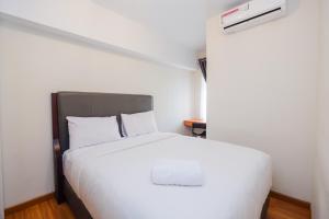 Pool View and Homey 2BR Apartment Springlake Summarecon Bekasi By Travelio