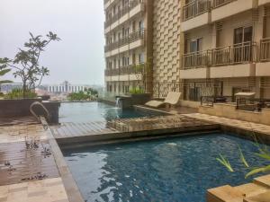 Twin Bed Studio Room at Annora Living Apartment By Travelio