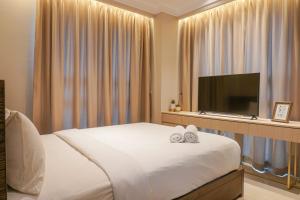 Elegant 2BR Citralake Suites Apartment By Travelio