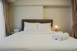 Modern 2BR Apartment at Maqna Residence By Travelio