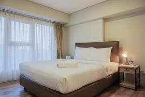 Modern 2BR Apartment at Maqna Residence By Travelio