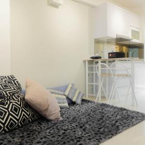 Stylish and Modern 2BR Bassura City Apartment By Travelio