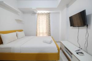 Minimalist Studio at Azalea Suites Cikarang Apartment By Travelio