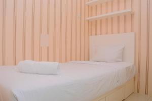 Chic and Cozy 2BR Apartment at Bassura City By Travelio