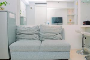 Chic and Cozy 2BR Apartment at Bassura City By Travelio