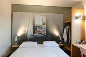 Hotels B&B HOTEL Poitiers 1 Futuroscope : photos des chambres