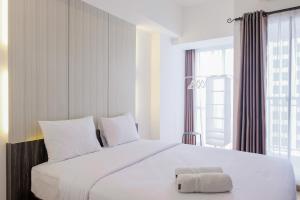 Fully Parquette City View Studio Apartment at M-Town Residence By Travelio