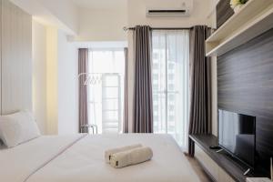 Fully Parquette City View Studio Apartment at M-Town Residence By Travelio