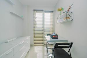 Minimalist and Posh 1BR The Oasis Cikarang Apartment By Travelio