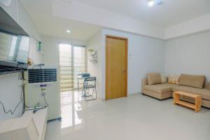 Minimalist and Posh 1BR The Oasis Cikarang Apartment By Travelio