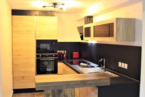 Appartements Le Clos Casi - 3 Vallees - Ski - Cures thermales : photos des chambres