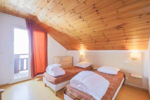 Appartements Residence Les Chalets de Puy Saint Vincent - maeva Home : photos des chambres