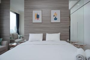 Cozy and Tranquil Studio Menteng Park Apartment By Travelio