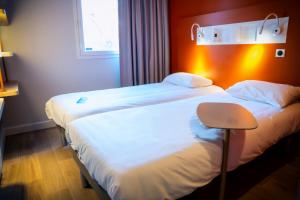 Hotels ibis budget Reims Parc Des Expositions : photos des chambres