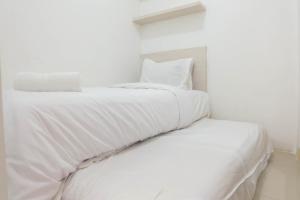 Warm and Cozy 2BR Green Pramuka Apartment near Mall By Travelio