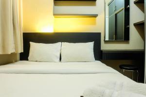 Pleasant 2BR Apartment at Green Pramuka City near Mall By Travelio