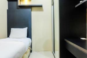 Pleasant 2BR Apartment at Green Pramuka City near Mall By Travelio