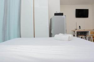 Comfy and Warm Studio Grand Kamala Lagoon Apartment By Travelio