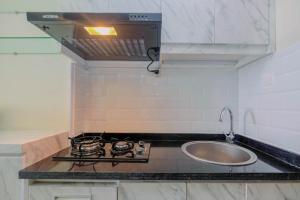 Cozy and Minimalist Studio Apartment @ Mustika Golf Residence By Travelio