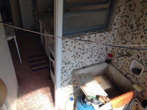 Apartamento Praia Grande, Vila Tupi, em frente ao mar, com retirada de chaves na casa da proprietária