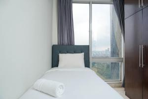 Relaxing 2BR at The Empyreal Condominium Epicentrum Apartment By Travelio