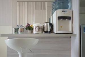 Minimalist and Stylish Studio Skylounge Tamansari Apartment By Travelio