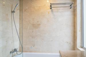 Comfortable Deluxe 2BR at The Empyreal Condominium Epicentrum Apartment By Travelio