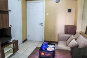 Comfortable and Tranquil 2BR Apartment at Green Pramuka By Travelio