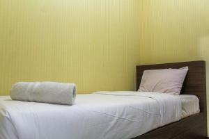 Comfortable and Tranquil 2BR Apartment at Green Pramuka By Travelio