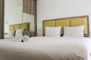 Relaxing 2BR Apartment at M-Town Residence By Travelio