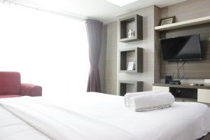 Prime and Comfy Studio at Tamansari La Grande Apartment By Travelio