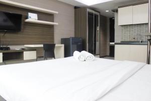 Prime and Comfy Studio at Tamansari La Grande Apartment By Travelio