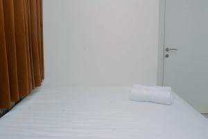 2BR Bassura City Apartment with Nice Interior Design By Travelio