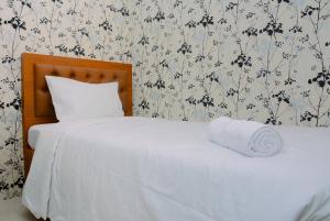 2BR Bassura City Apartment with Nice Interior Design By Travelio