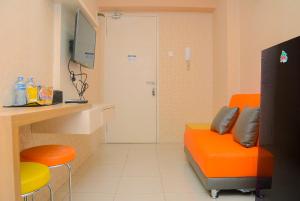 Minimalist 1BR with Pool View at Bassura City Apartment By Travelio