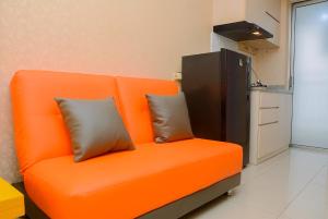 Minimalist 1BR with Pool View at Bassura City Apartment By Travelio