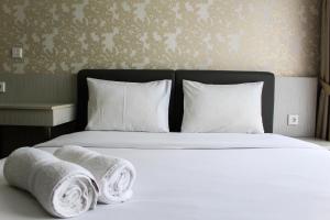 Minimalist 1BR Apartment at M-Town Signature By Travelio