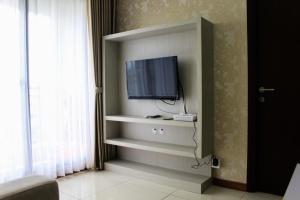 Minimalist 1BR Apartment at M-Town Signature By Travelio