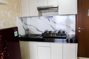 Minimalist 1BR Apartment at M-Town Signature By Travelio