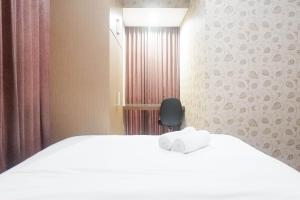 Minimalist 2BR Apartment at Tamansari Papilio By Travelio