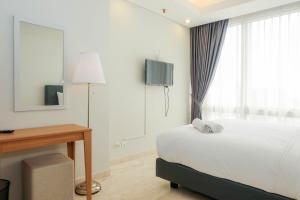 Posh 2BR with Private Lift at Masterpiece The Epicentrum Kuningan Apartment By Travelio
