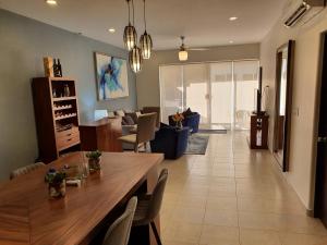 Beach Bliss Retreat, Renovated Condo with Rooftop Pool, Grill, and Game Night Vibes!