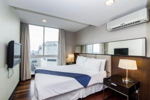 Studio room in The Narathiwas Sathorn Bangkok Hotel