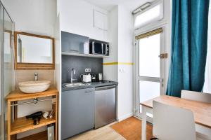 Appartements cosy independant studio proche gare et jardin : photos des chambres