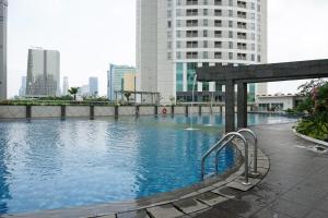 Amazing 1BR Apartment at The Wave Kuningan By Travelio
