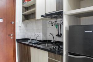 Comfy and Strategic Studio Signature Park Grande Apartment By Travelio